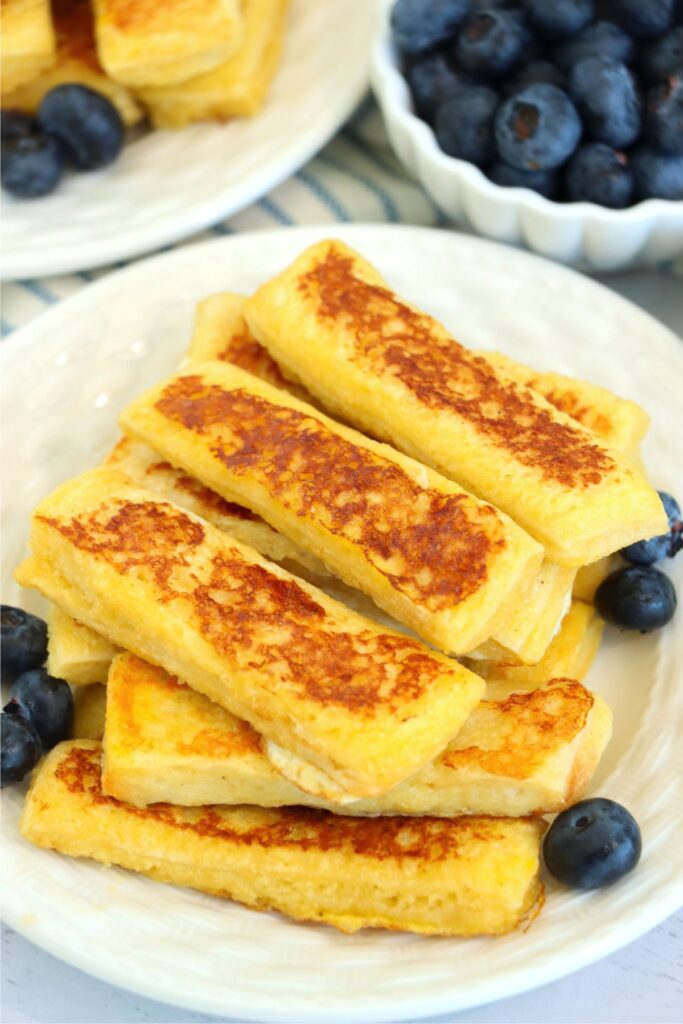 Closeup shot of Jack in the Box French toast sticks with blueberries on plate