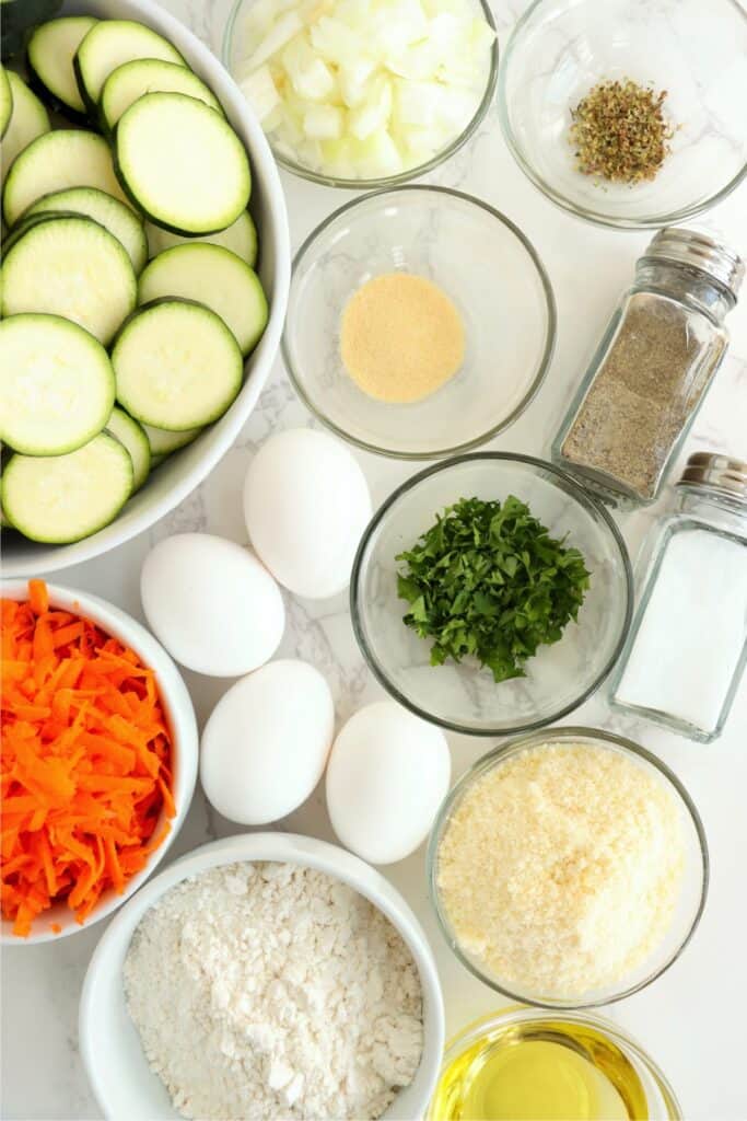 Overhead shot of individual zucchini carrot casserole ingredient on table