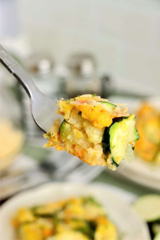 Closeup shot of forkful of zucchini carrot casserole