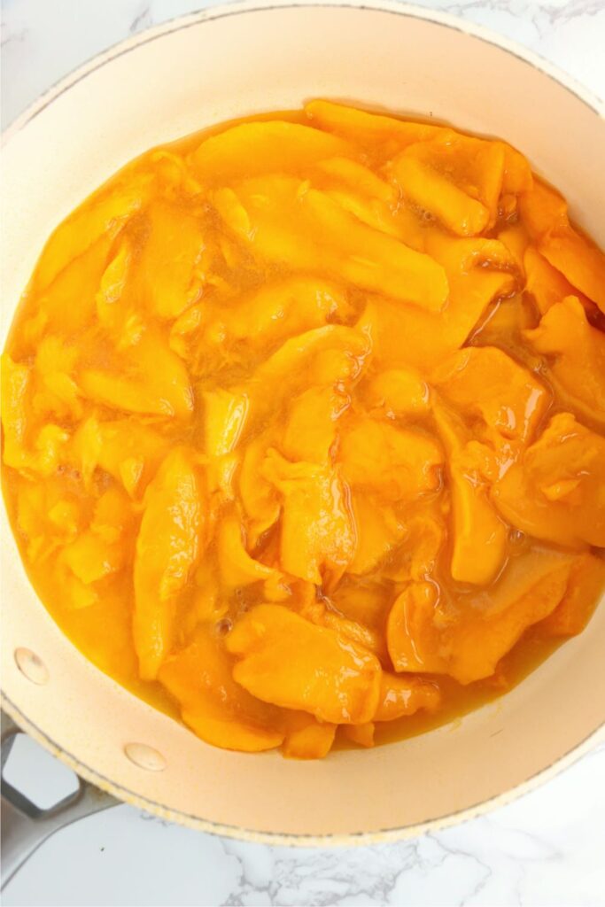 Overhead shot of mango mixture in pot.