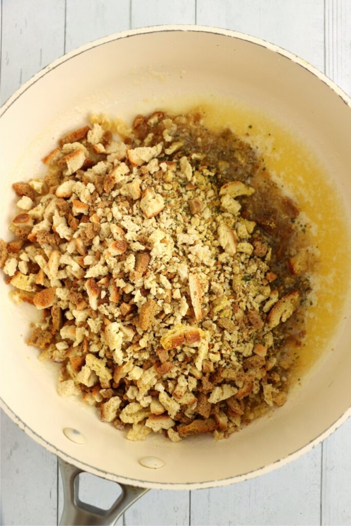 Overhead shot of butter and stuffing in skillet. 