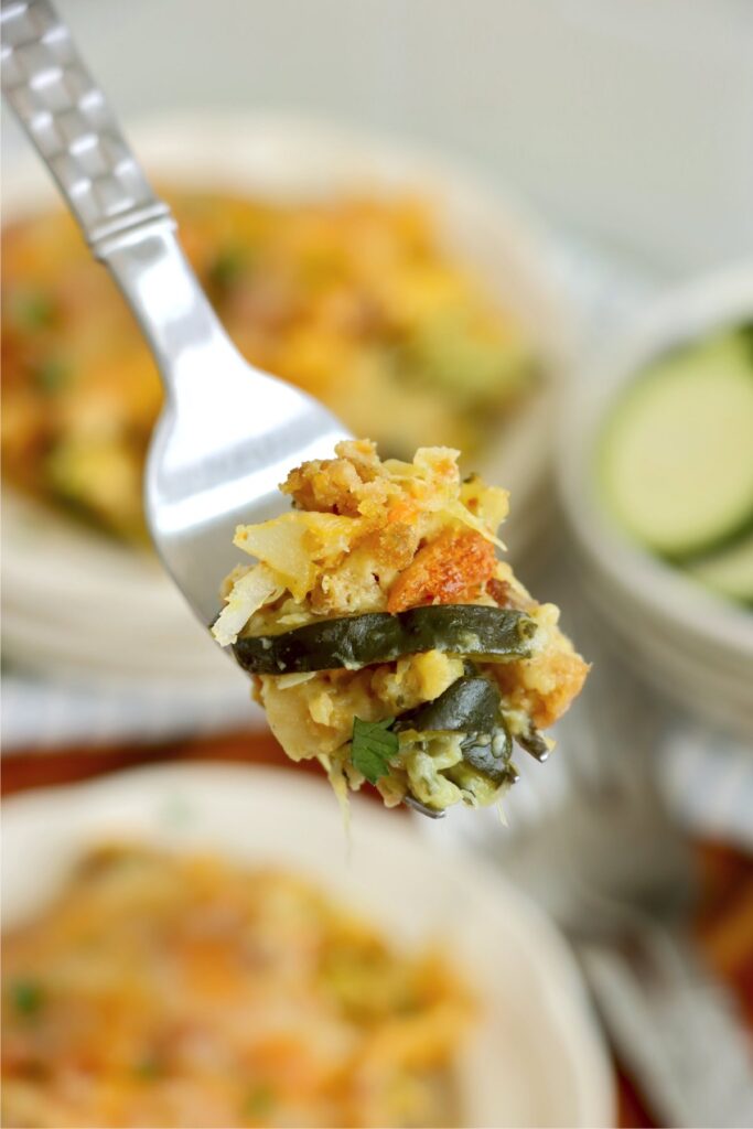 Closeup shot of forkful of old fashioned zucchini casserole