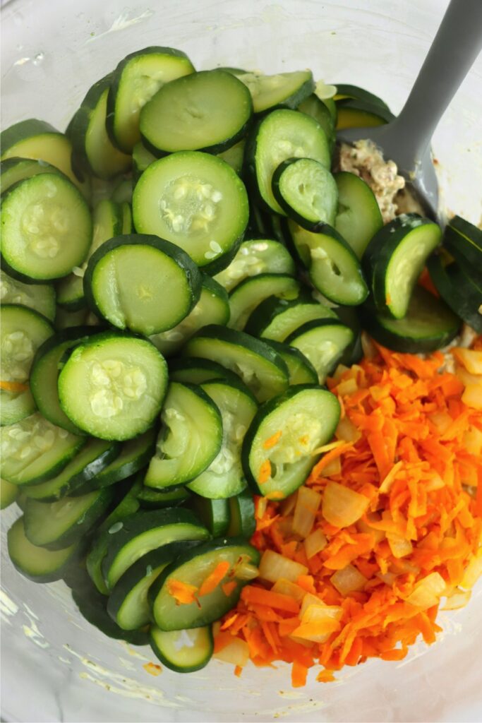 Closeup shot of zucchini, carrots, onions, and cream soup mixture in bowl