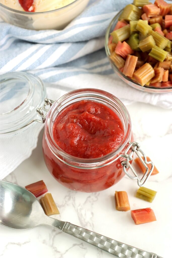 Overhead shot of homemade rhubarb sauce in glass jar.