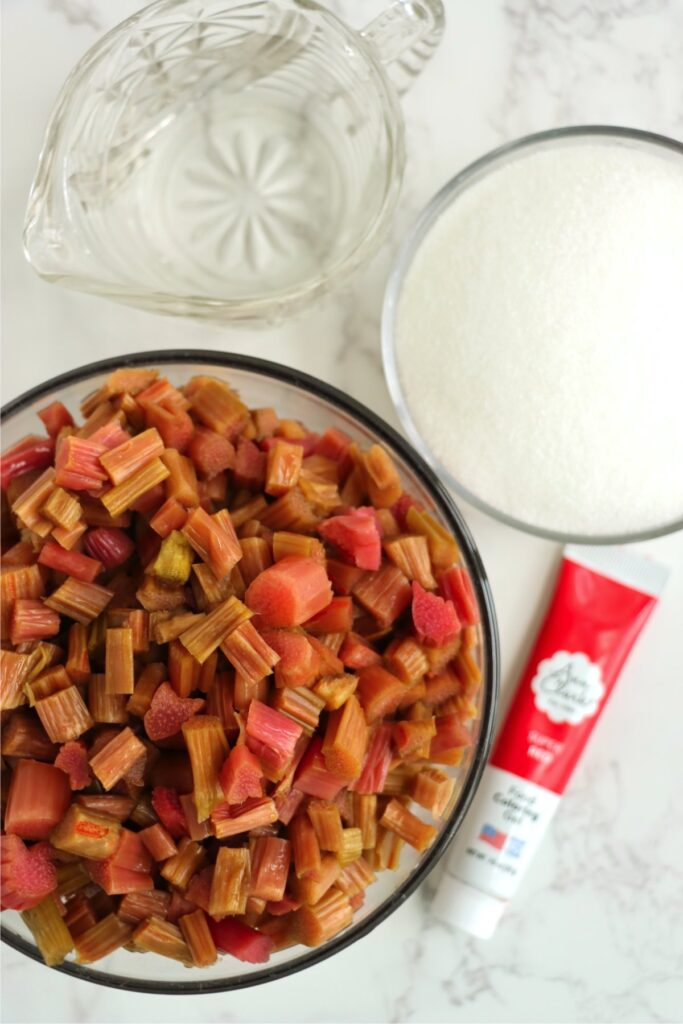 Overhead shot of individual homemade rhubarb sauce ingredients on table