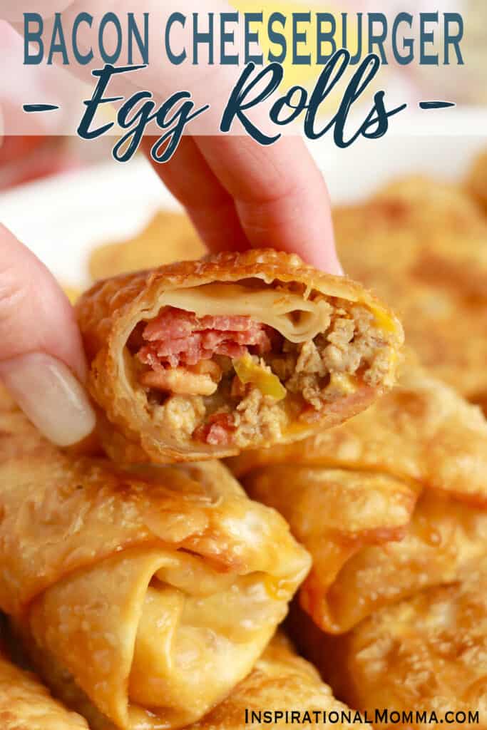 Closeup shot of hand holding a bacon cheeseburger egg roll with bite taken out.