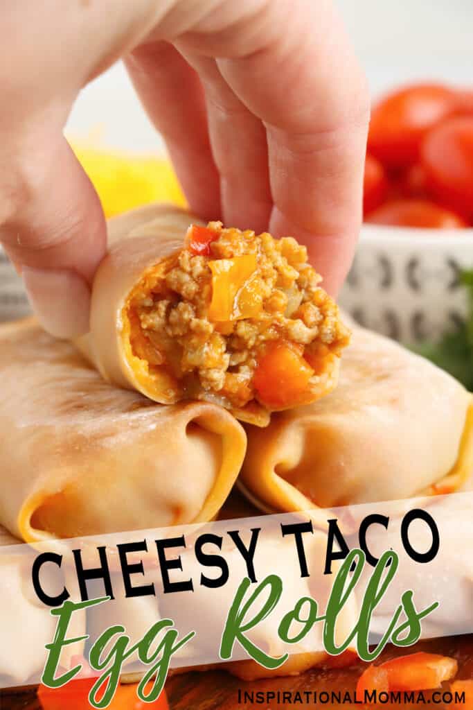 Closeup shot of stack of taco egg rolls with top egg roll cut in half.