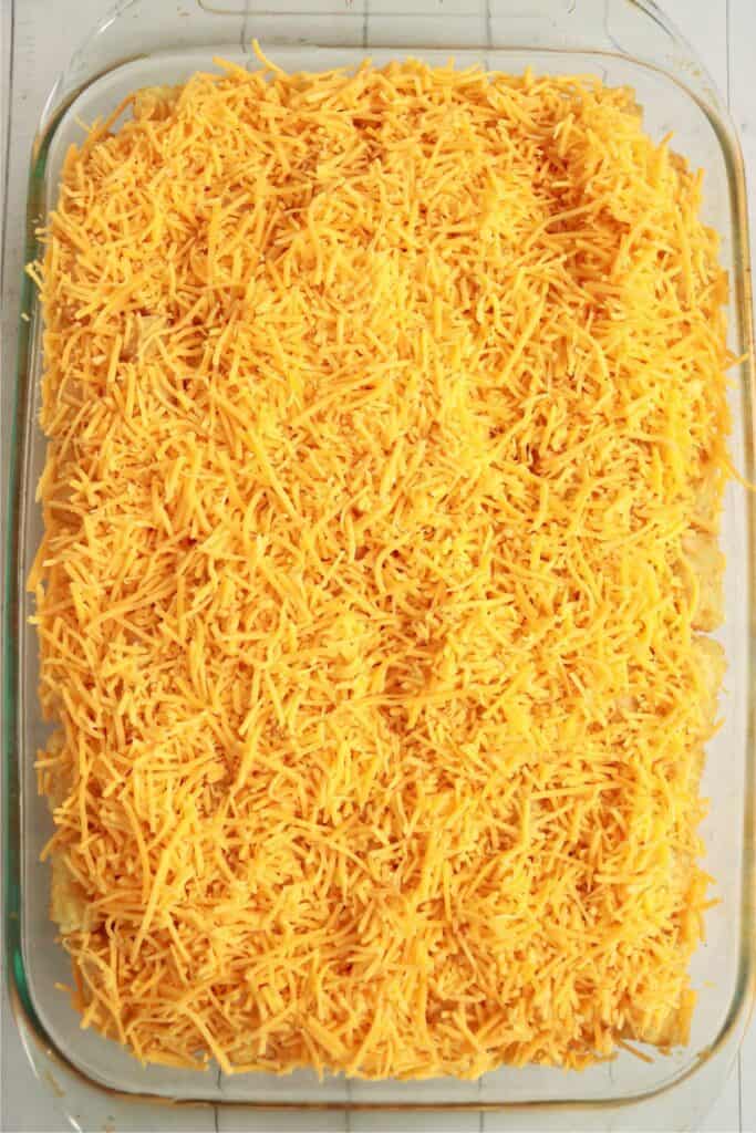 Overhead shot of unbaked tater tot hot dog casserole in baking dish