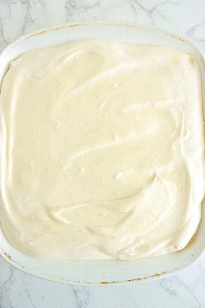Overhead shot of cheesecake mixture in dish. 