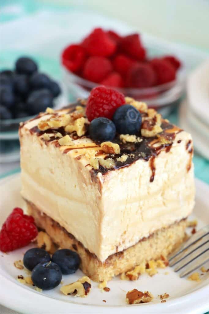 Closeup shot of slice of drumstick ice cream cake on plate. 