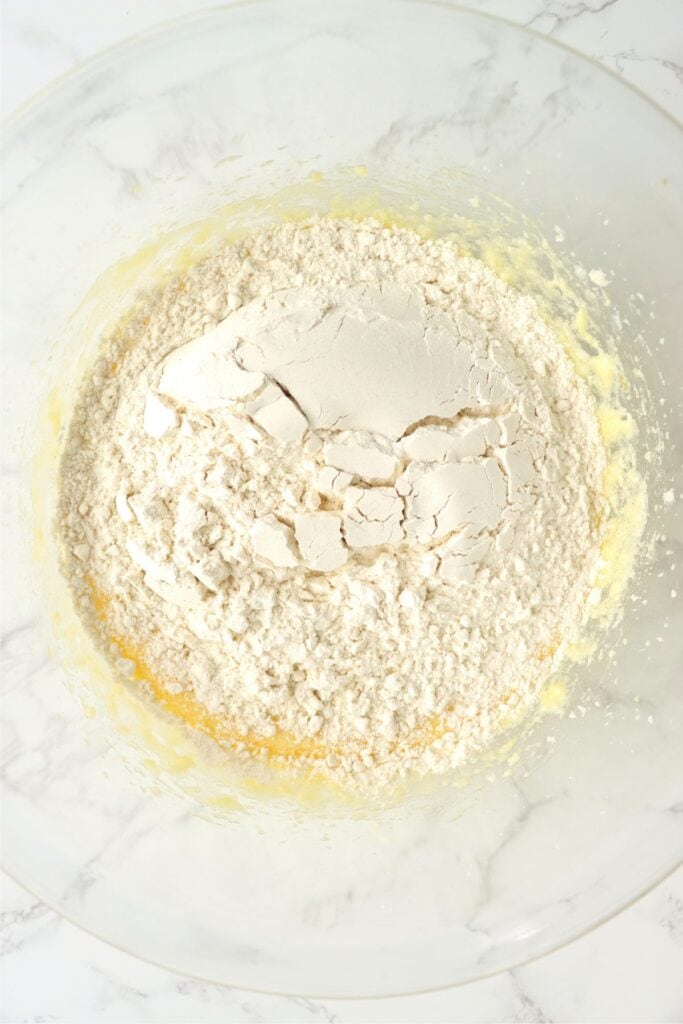 Overhead shot of flour in bowl with wet mixed ingredients