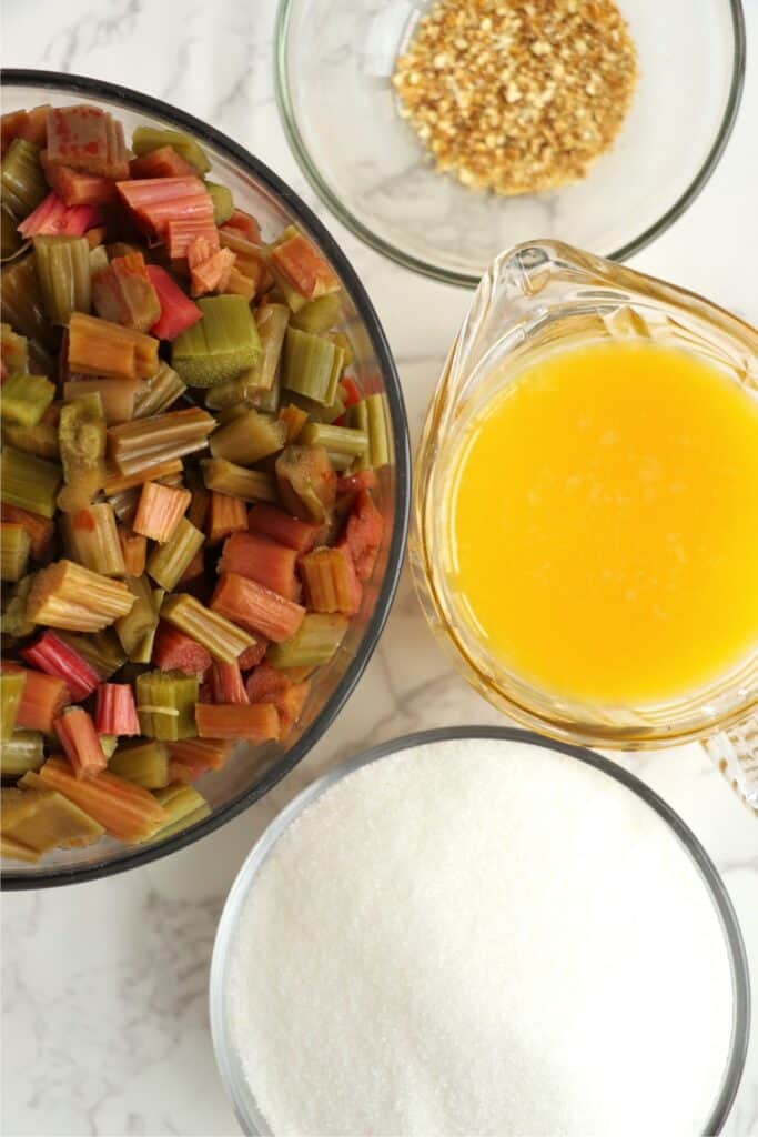 Overhead shot of individual homemade rhubarb jam ingredients on table