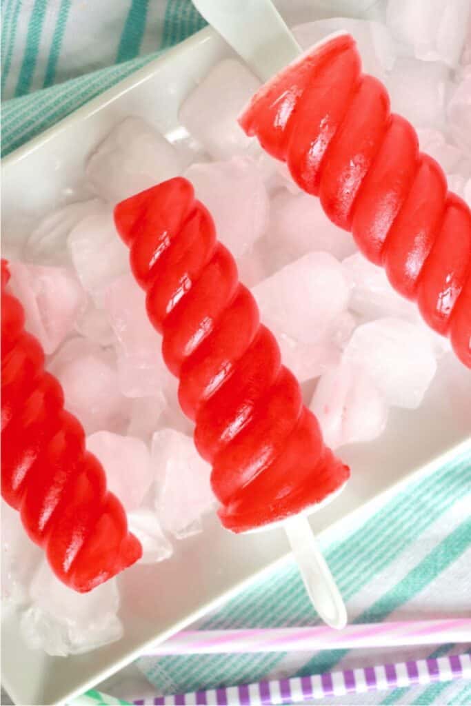 Overhead shot of Kool Aid popsicles on ice tray.