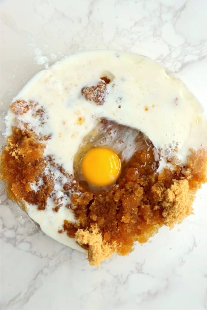 Overhead shot of wet muffin ingredients in mixing bowl.