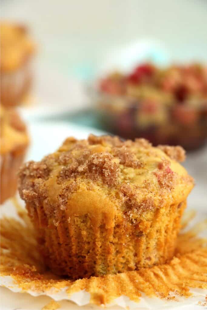 Closeup shot of homemade rhubarb muffin with muffin paper removed. 