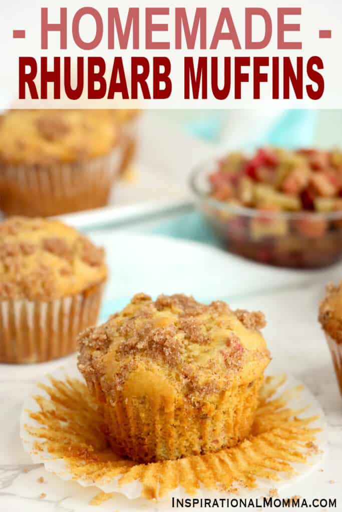 Closeup shot of homemade rhubarb muffin on table with more muffins and a bowl of rhubarb in a bowl in background