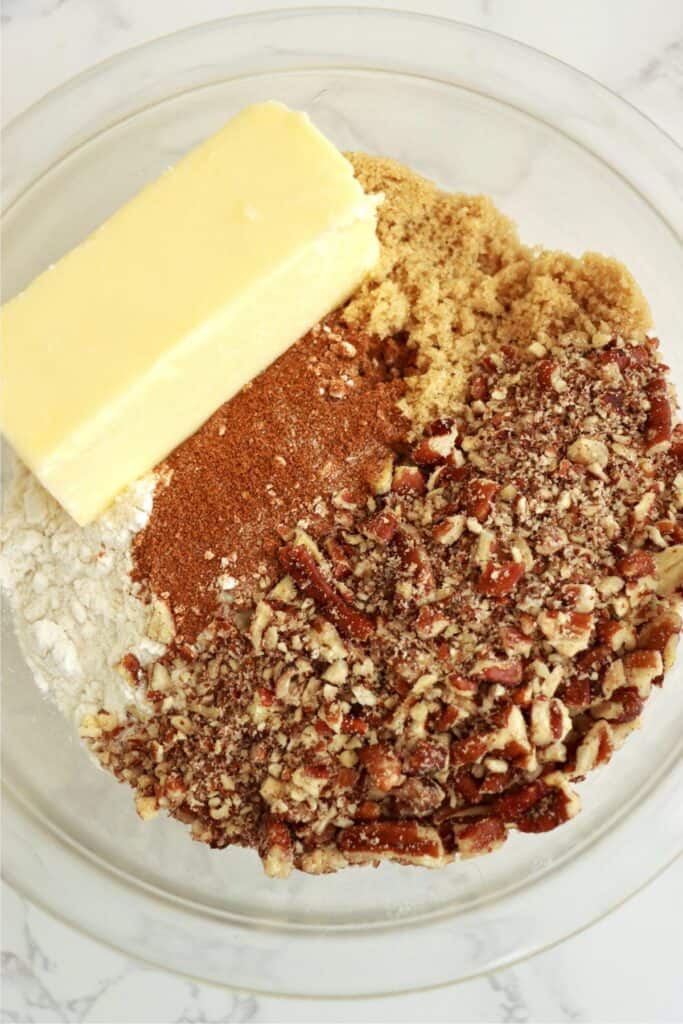 Overhead shot of all streusel ingredients in mixing bowl