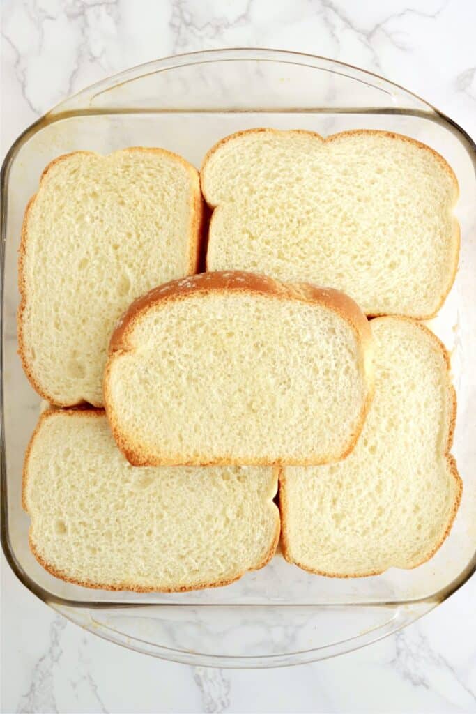 Overhead shot of bread slices in baking dish