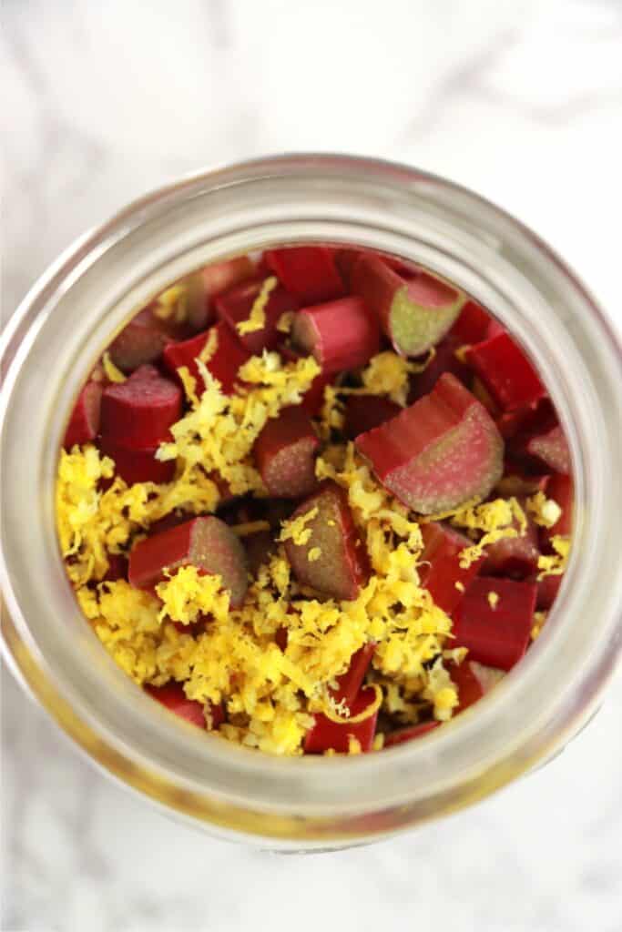 Overhead shot of rhubarb and lemon zest in jar