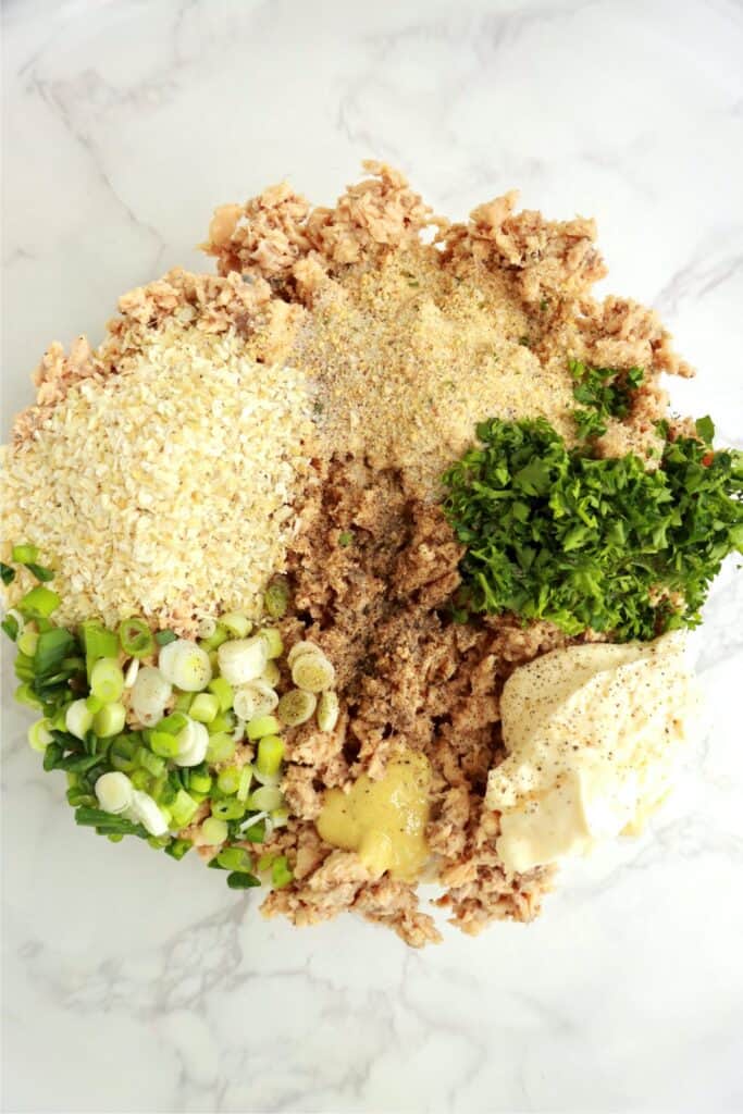 Overhead shot of salmon patty ingredients in bowl.