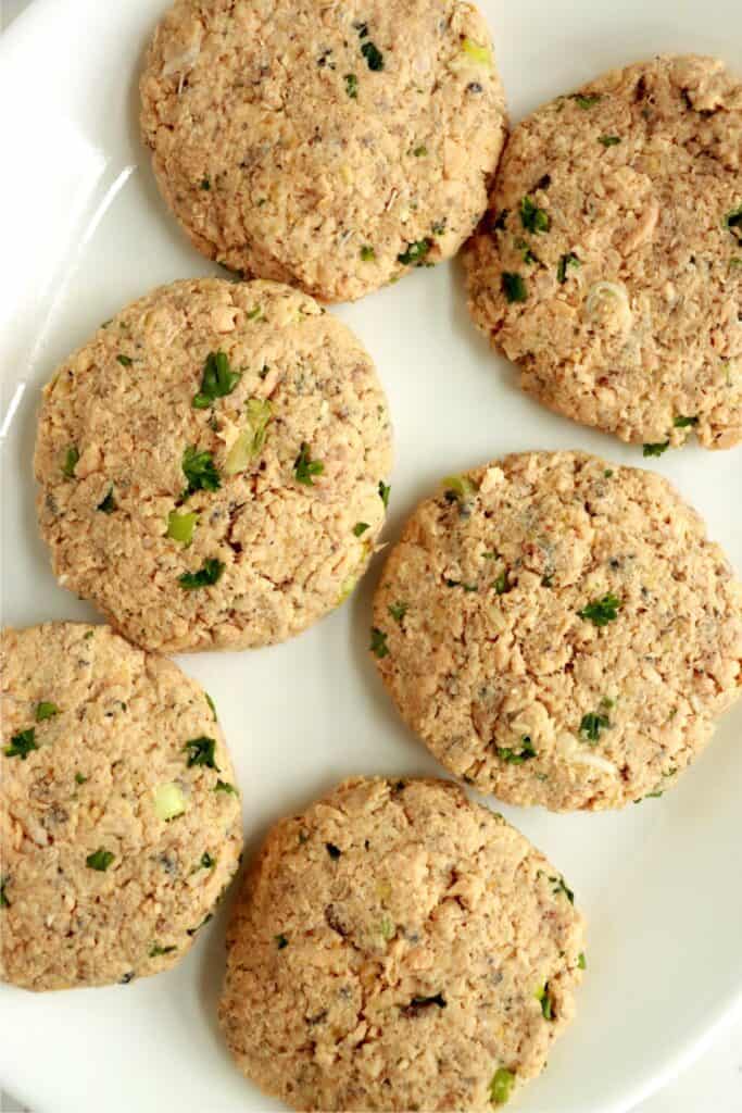 Overhead shot of 6 salmon patties on plate.