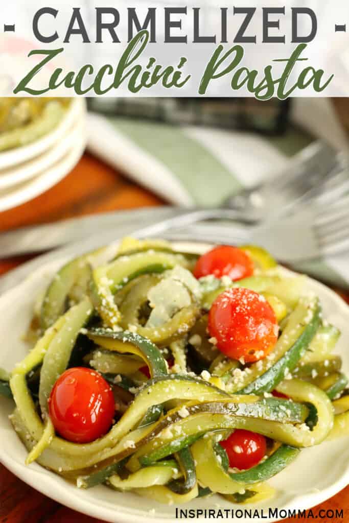 Plateful of caramelized zucchini pasta with cherry tomatoes and parmesan cheese.