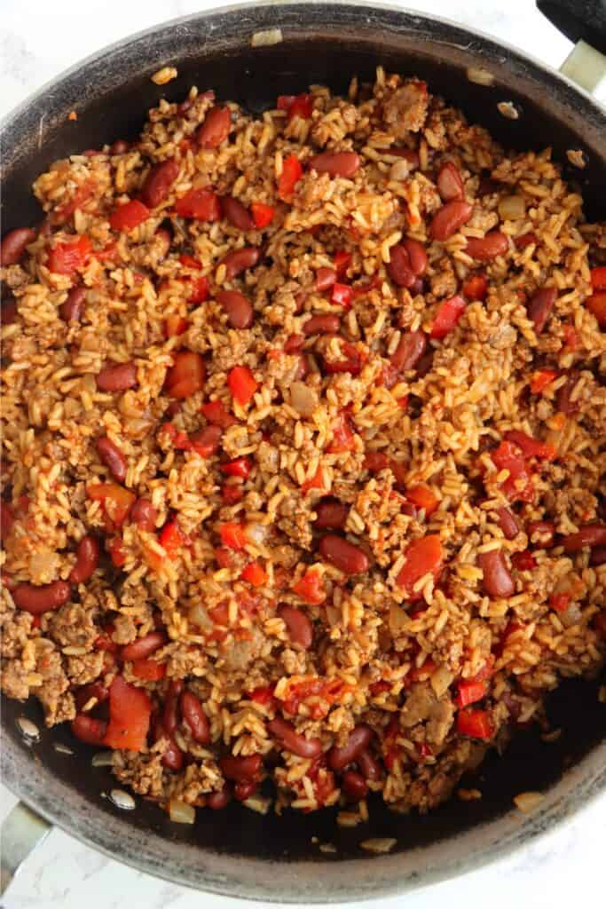 Overhead shot of cooked southwestern beef and rice skillet in skillet.