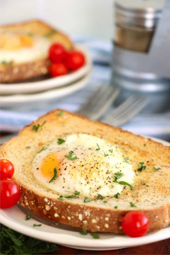 Closeup shot of air fryer egg on toast on plate. 