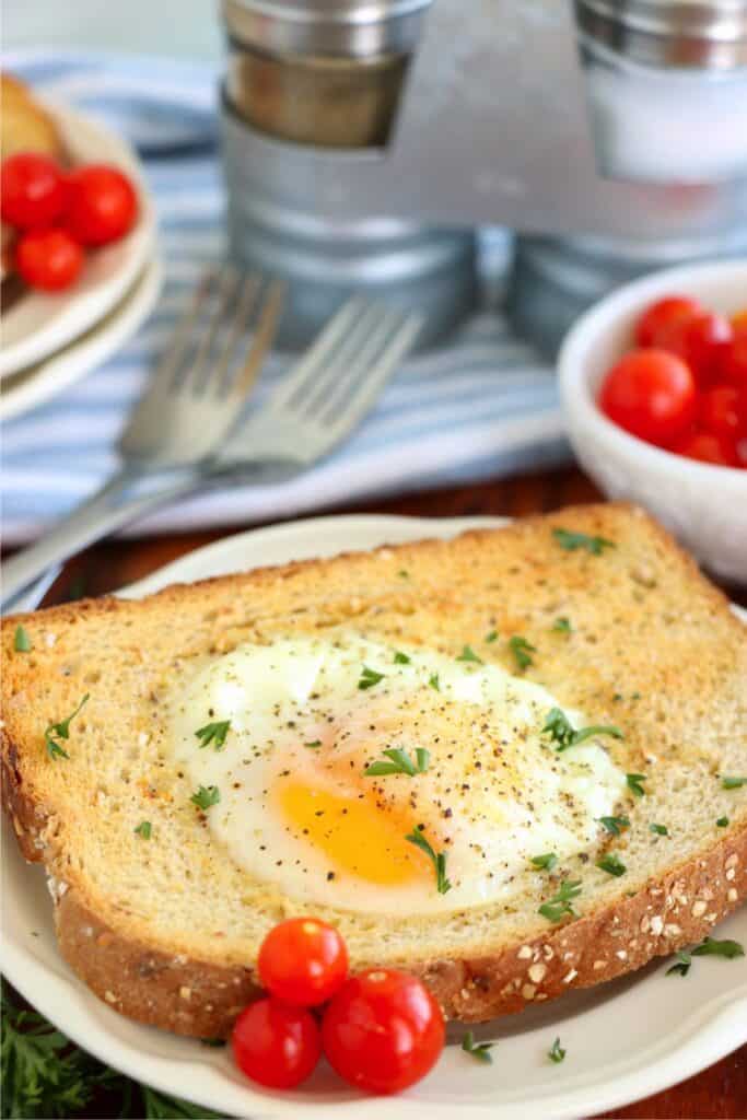 Closeup shot of air fryer egg on toast on plate. 