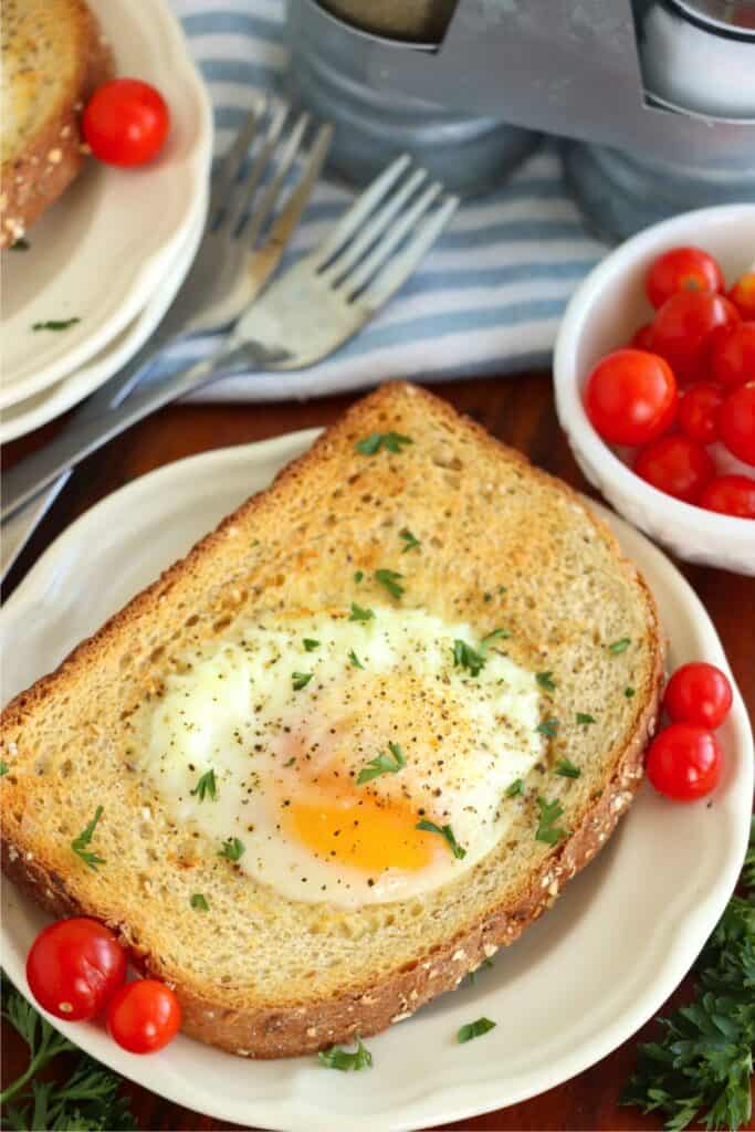 Closeup shot of air fryer egg on toast on plate. 