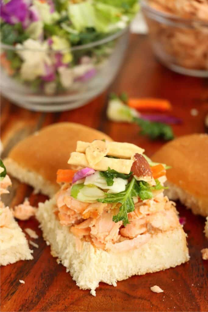 Closeup shot of salmon slider with no top bun.