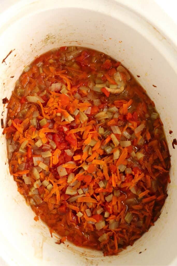 Overhead shot of cooked slow cooker Moroccan chicken thighs in slow cooker