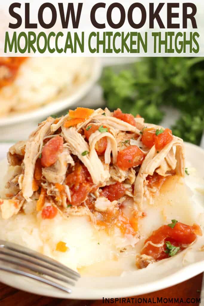 Closeup shot of slow cooker Moroccan chicken thighs over mashed potatoes.