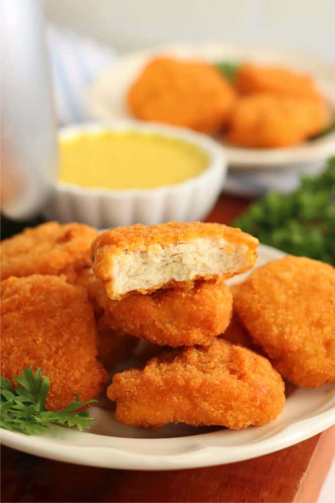 Closeup shot of Tyson air fryer chicken nuggets in a pile on a plate. 