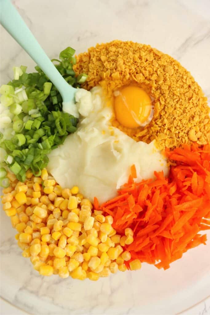 Closeup overhead shot of mashed potato pattie ingredients in bowl