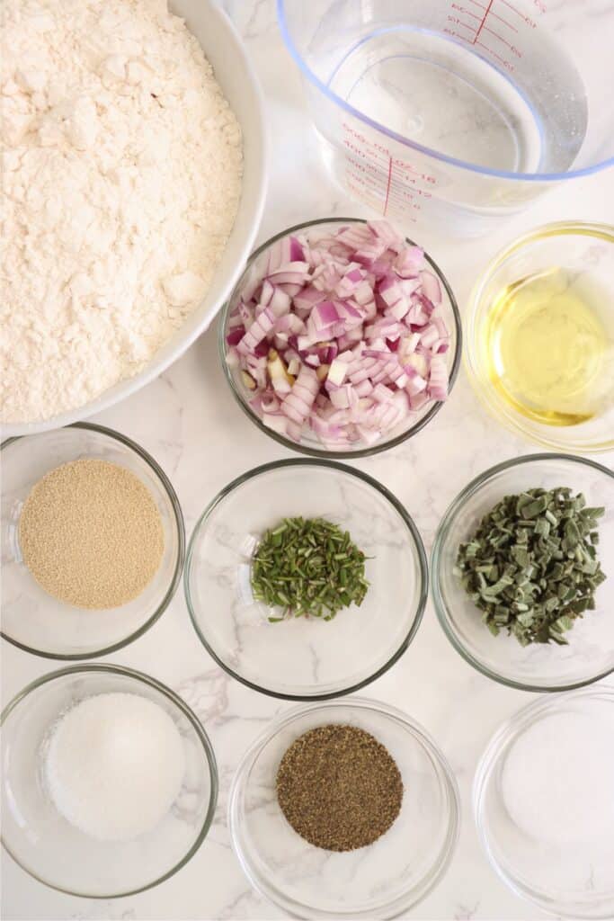 Overhead shot of individual sage bread ingredients in bowls on table