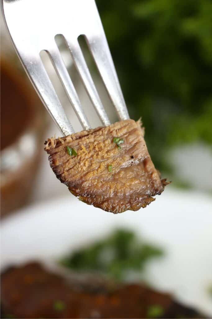 Closeup shot of forkful of tender slow cooker Vietnamese pot roast. 