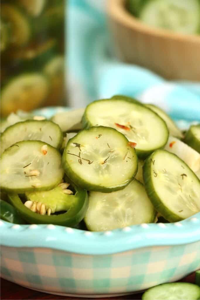 Closeup shot of bowlful of sweet and spicy pickles. 