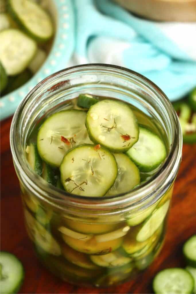 Overhead shot of jarful of sweet and spicy pickles. 