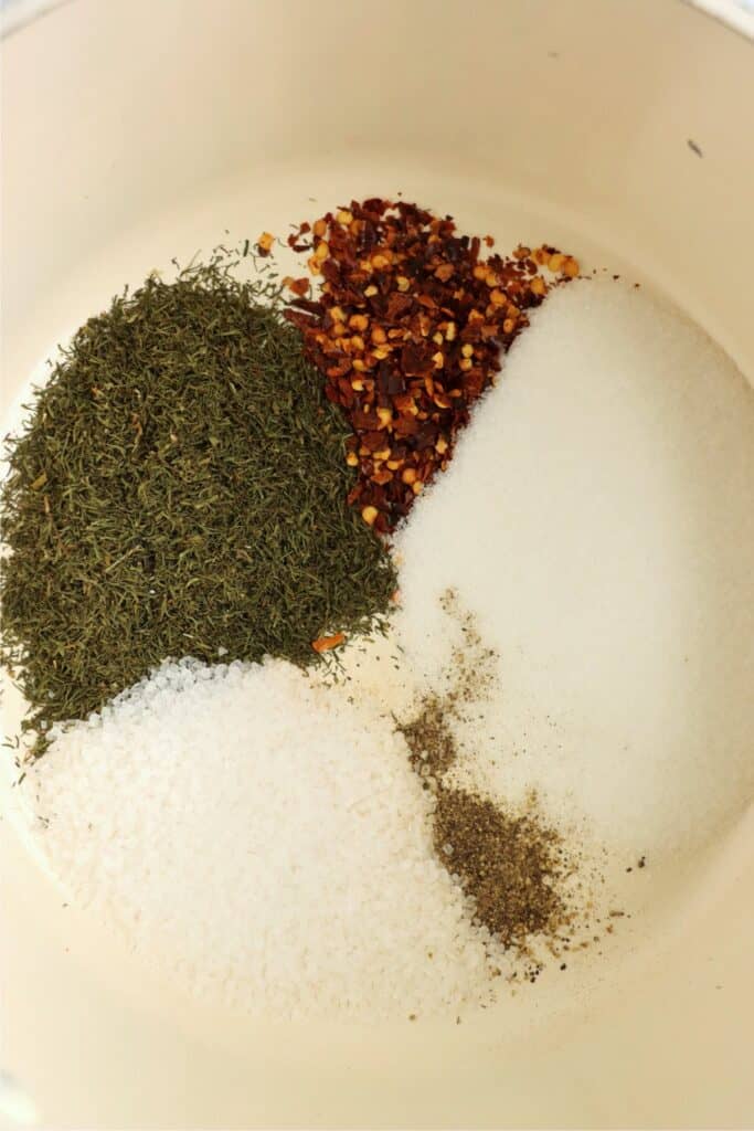 Overhead shot of pickle spices in a pot. 