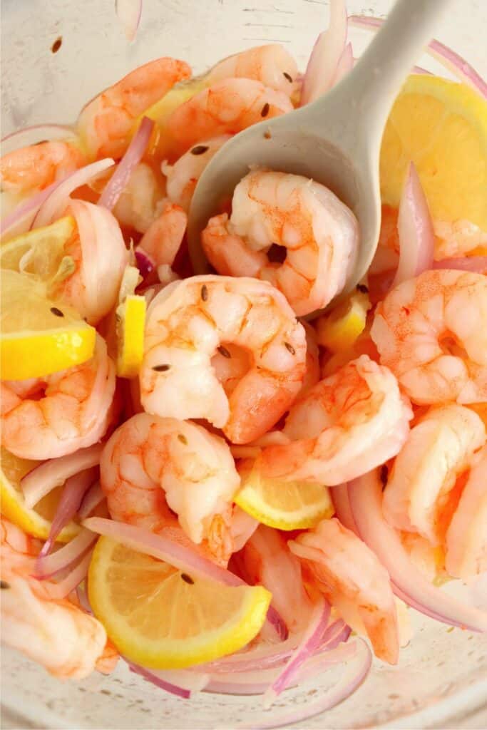 Closeup overhead shot of pickled shrimp mixture in bowl