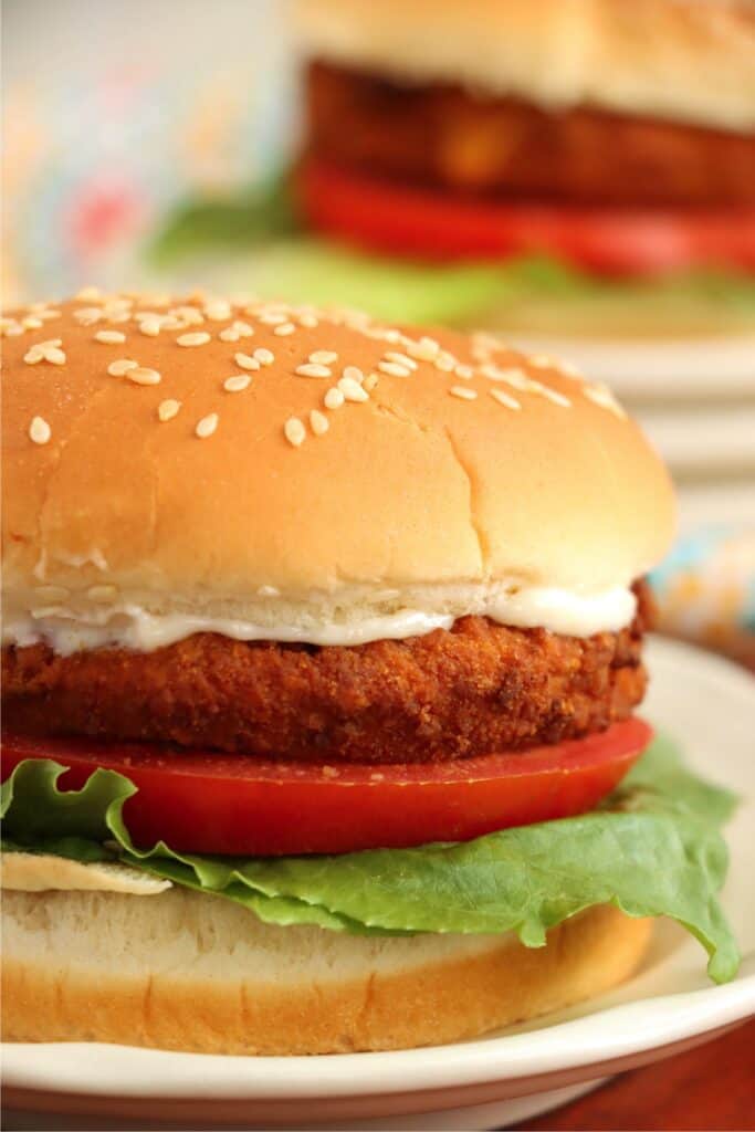 Closeup shot of air fryer chicken patty sandwich with mayo, lettuce, and tomato