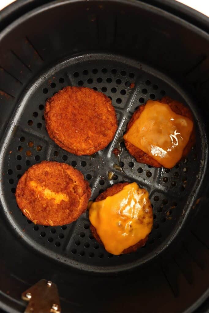 Overhead shot of air fryer chicken patties in air fryer basket