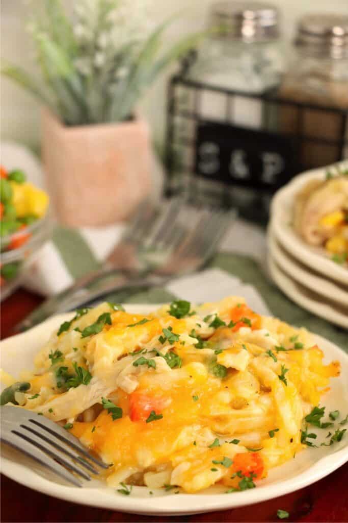 Closeup shot of plateful of chicken hash brown casserole. 