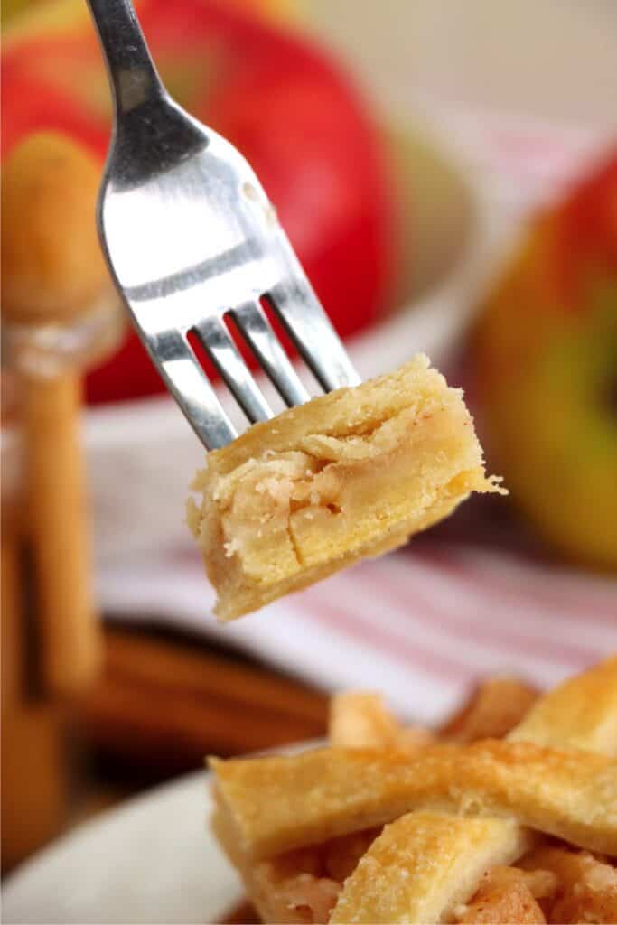 Closeup shot of forkful of homemade apple bar.