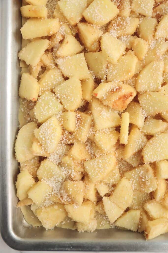 Closeup overhead shot of apple filling spread over crust. 