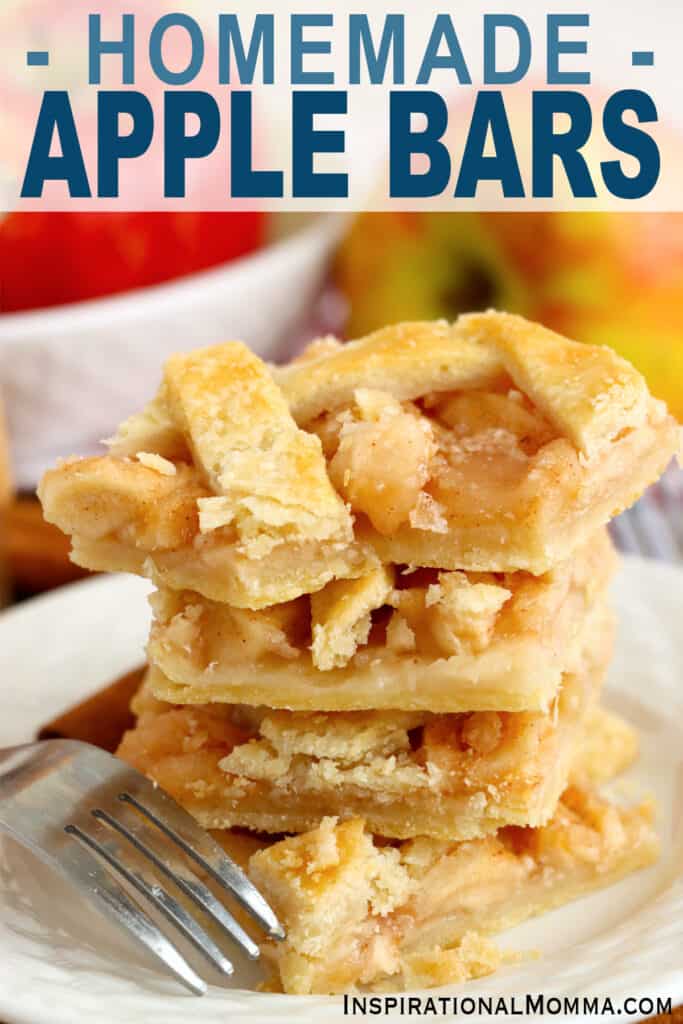 Four homemade apple bars stacked atop one another on plate.