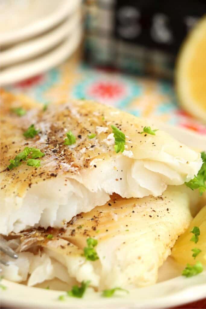 Closeup shot of plateful of air fryer frozen cod. 