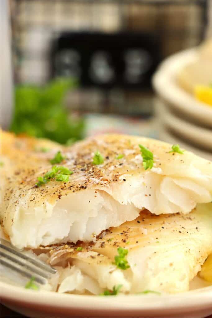 Closeup shot of two cod fillets on plate