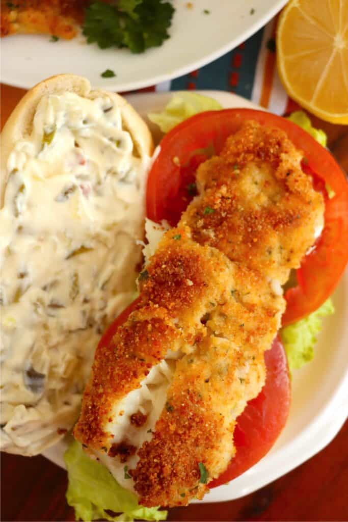 Overhead shot of open faced cod sandwich. 